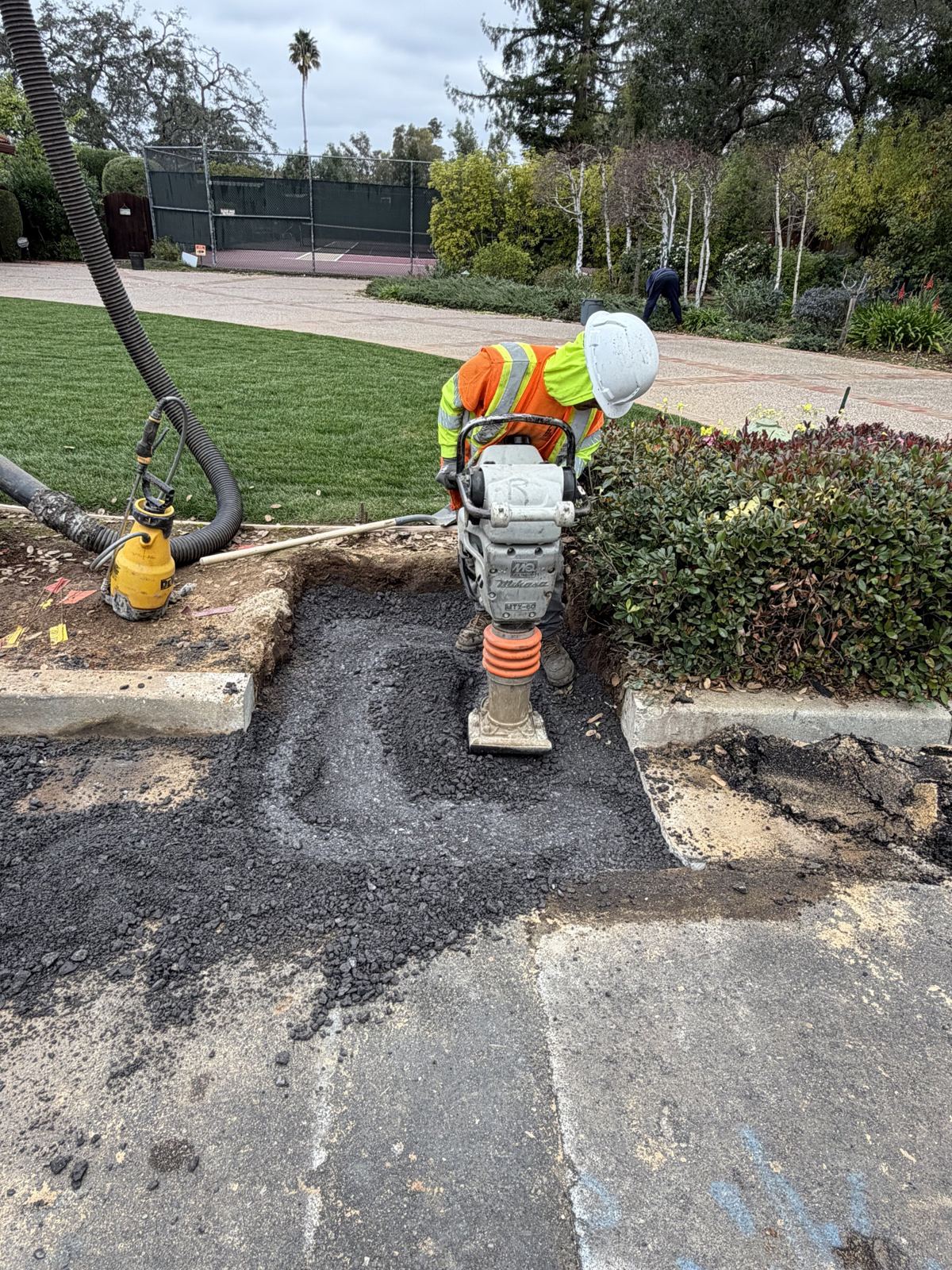 Compacting base in a trench patch