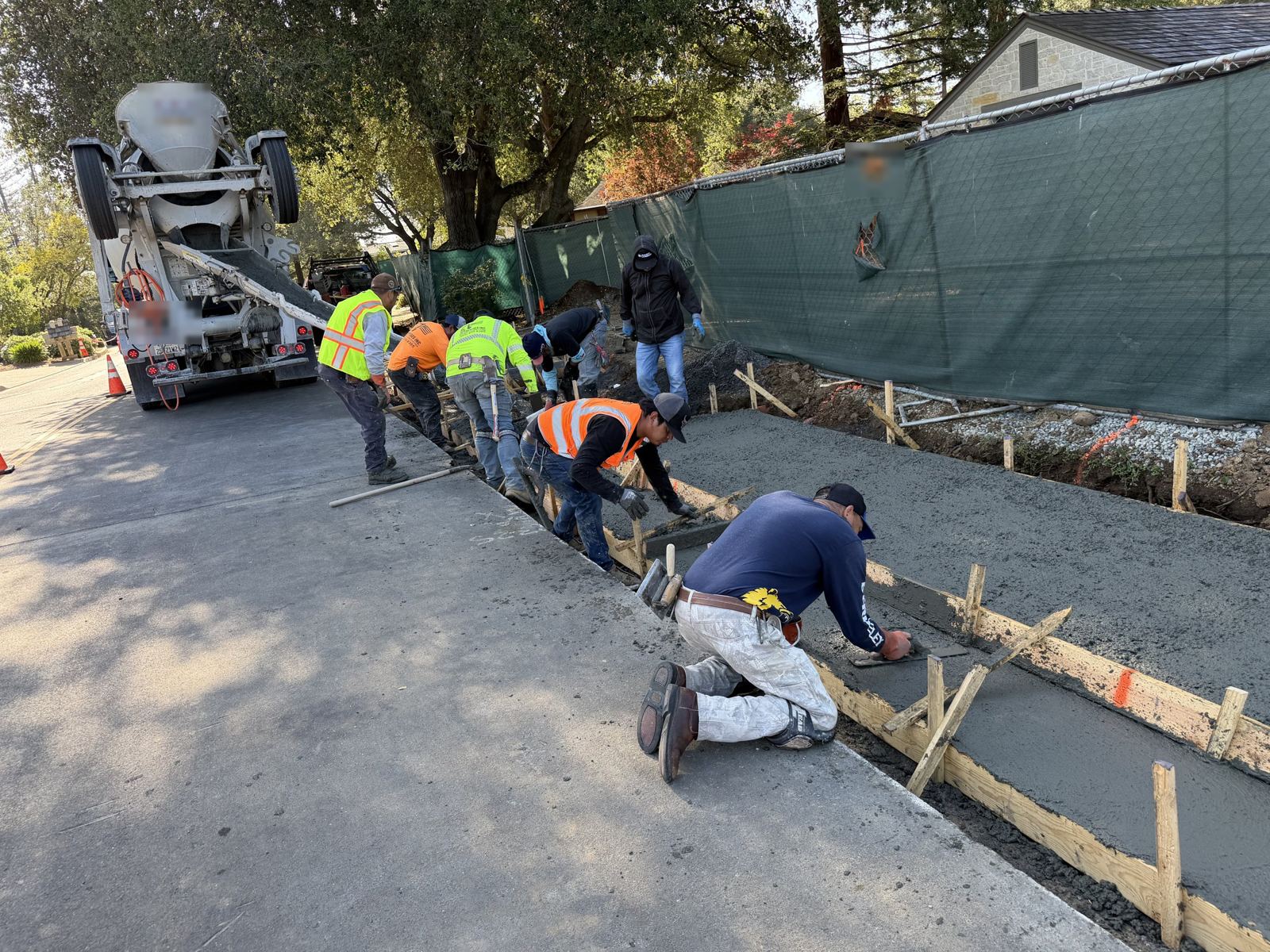 Crew forming and pouring curb and gutter