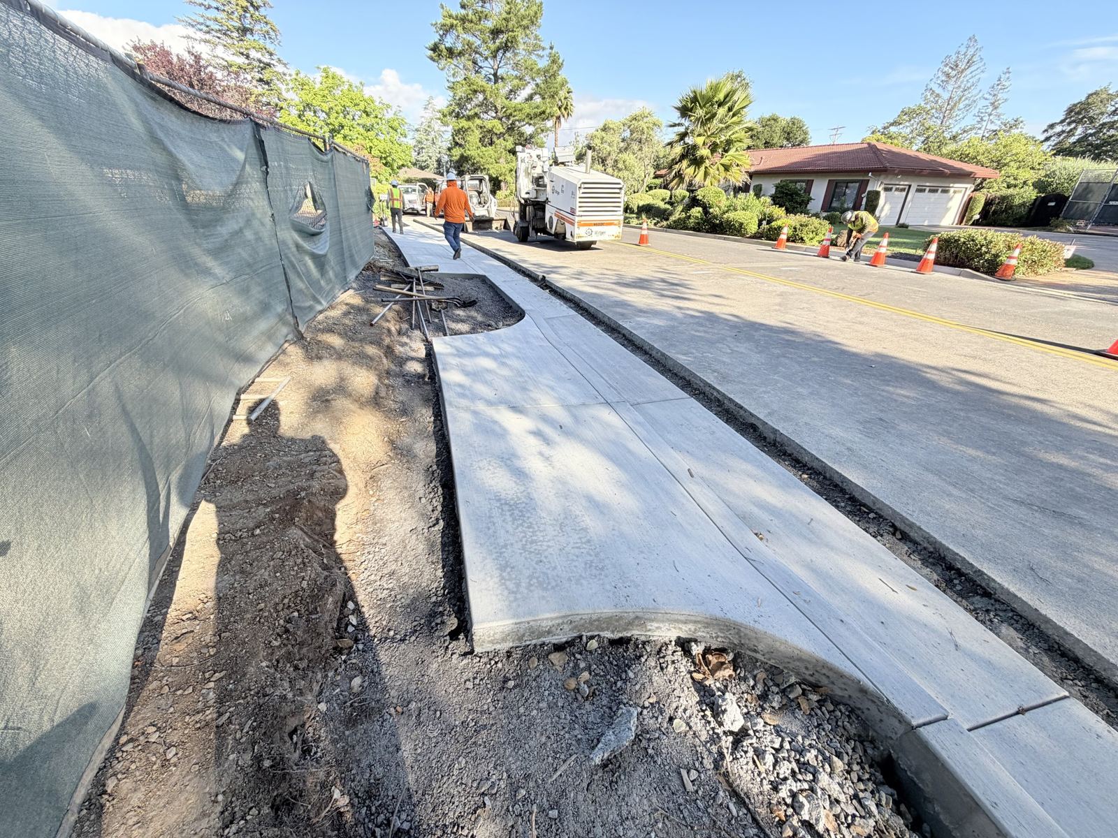 New sidewalk and curb along a residential street