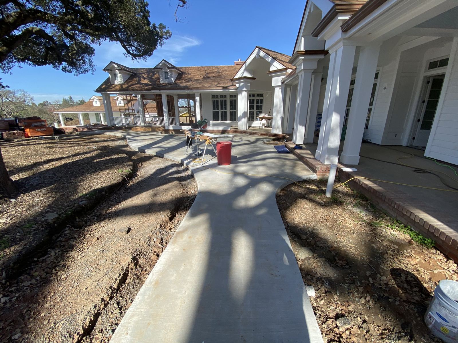 New concrete walkway at a custom home